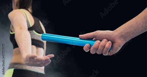 Composition of caucasian male runner passing baton to his teammate on black background