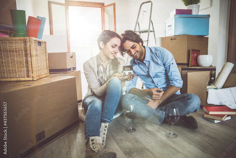 Young couple moving in into new apartment Young couple moving in into new apartment