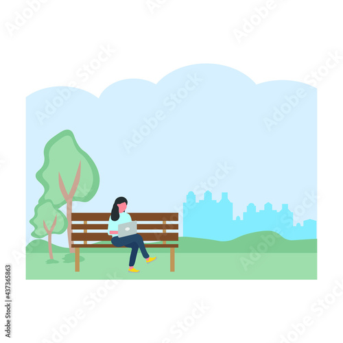 woman sitting on park bench with laptop