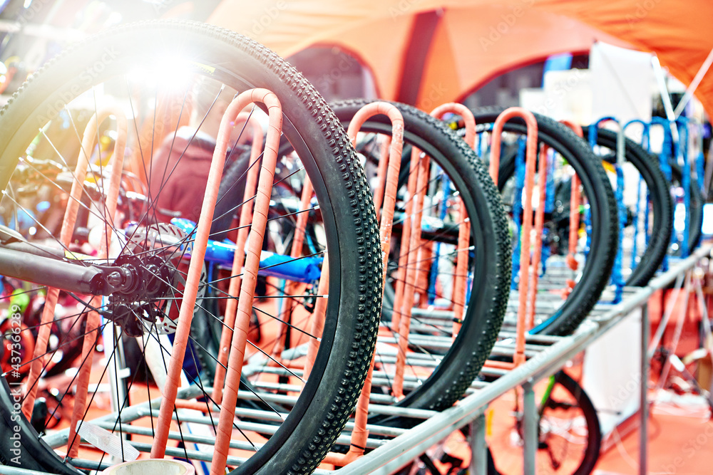 Bicycles on a vertical rack in store Bicycles on a vertical rack in store