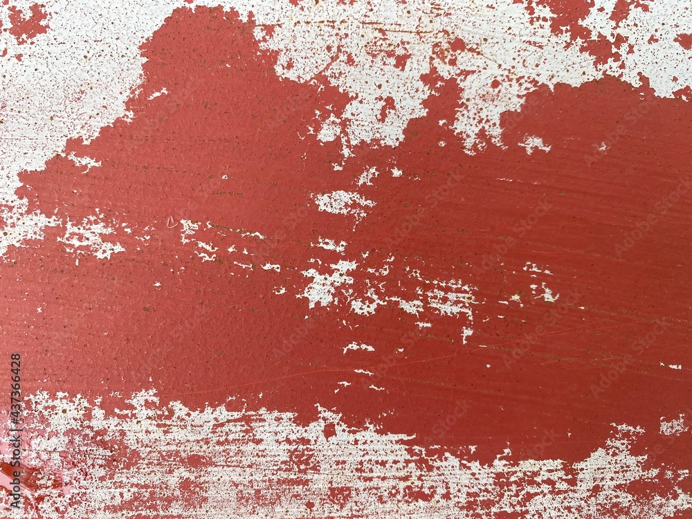 Closeup of peeling paint on a metal bar.