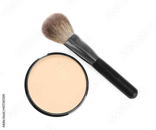 Face powder with brush on white background, top view. Makeup product
