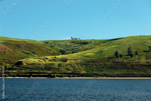 View of the river and green hills