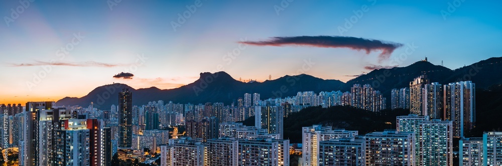 Panorama of sunset in Hong Kong City skyline and Lion Rock Hill
