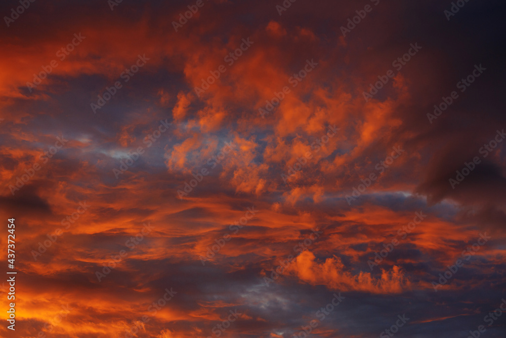 Orange sky with clouds at sunset