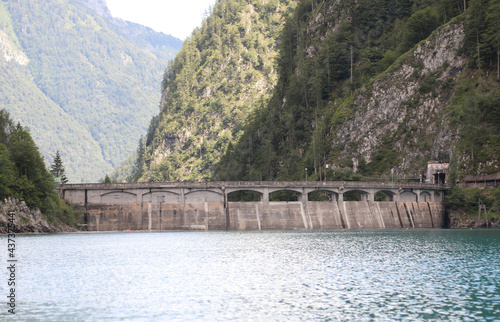 Sauris lake in Northern Italy with the great dam for the production of hydropower photo