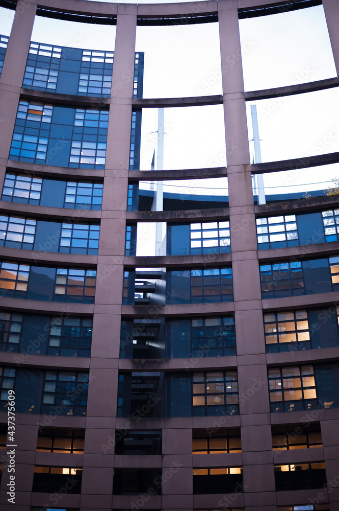 circulars courtyard in the evening with light in few windows