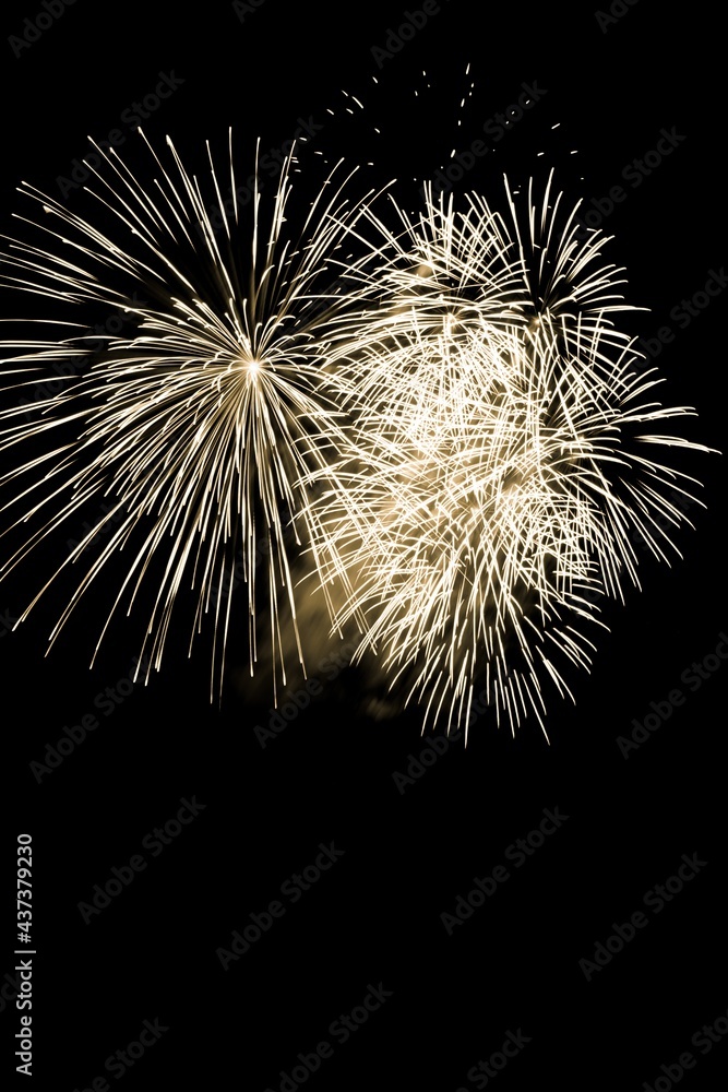 Luxury fireworks event sky show with yellow big bang stars. Premium entertainment magic star firework at e.g. New Years Eve or Independence Day party celebration. Black dark night background Luxury fireworks event sky show with yellow big bang stars. Premium entertainment magic star firework at e.g. New Years Eve or Independence Day party celebration. Black dark night background