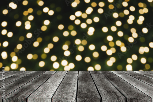 empty wooden board  table or modern wooden terrace with abstract night light bokeh at night festival in garden  christmas background  copy space for display product presentation  vintage color tone