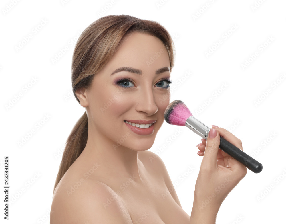 Beautiful young woman applying face powder with brush on white background Beautiful young woman applying face powder with brush on white background