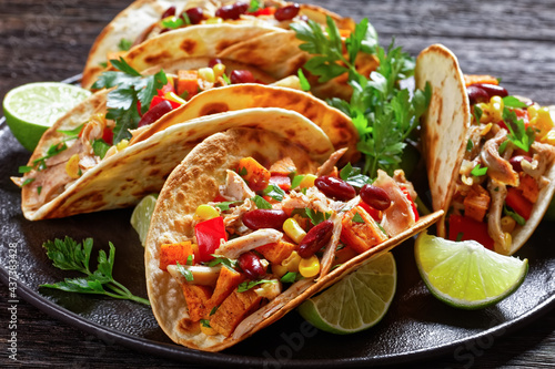 tacos with grilled chicken meat and veggies photo