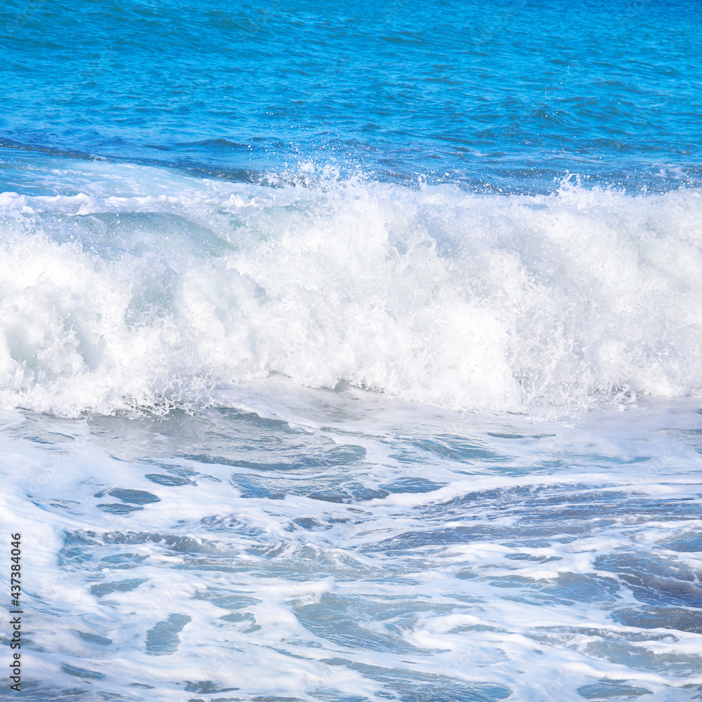 Big wave with sea foam and blue water Big wave with sea foam and blue water