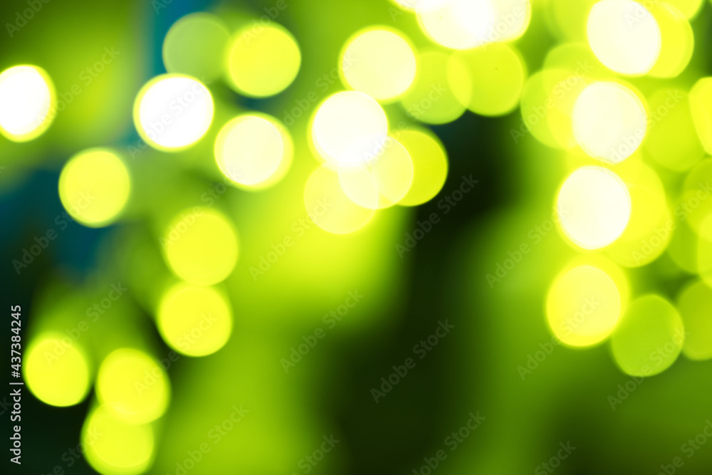 Obraz premium Holiday abstract green and yellow lights