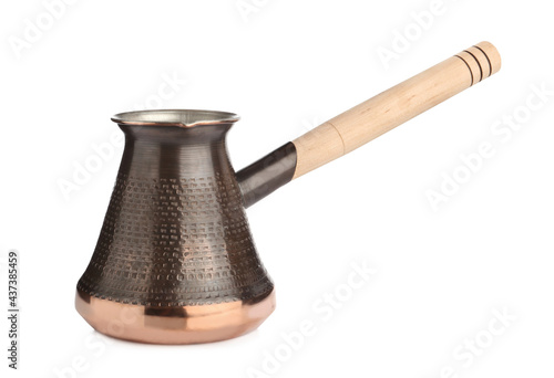 Beautiful copper turkish coffee pot with wooden handle isolated on white