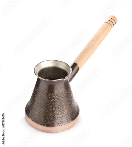 Beautiful copper turkish coffee pot with wooden handle isolated on white