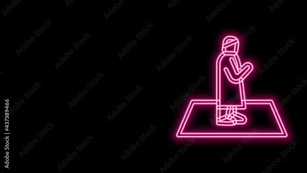 Glowing neon line Muslim man prays on the carpet icon isolated on black background. 4K Video motion graphic animation Glowing neon line Muslim man prays on the carpet icon isolated on black background. 4K Video motion graphic animation