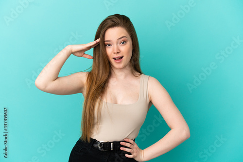 Teenager girl over isolated blue background has realized something and intending the solution © luismolinero