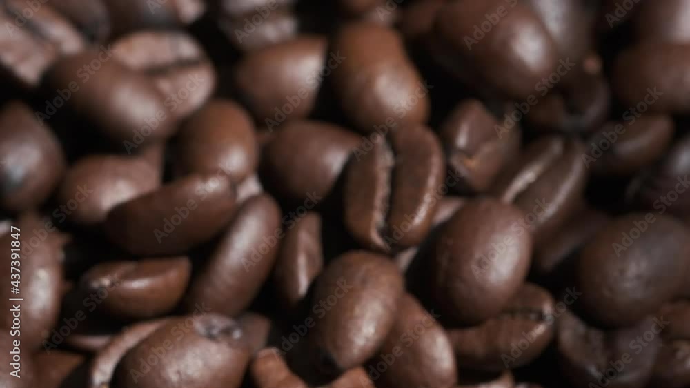 Coffee beans are falling, slow motion. Coffee beans roasted close-up.Vietnamese coffee Coffee beans are falling, slow motion. Coffee beans roasted close-up.Vietnamese coffee