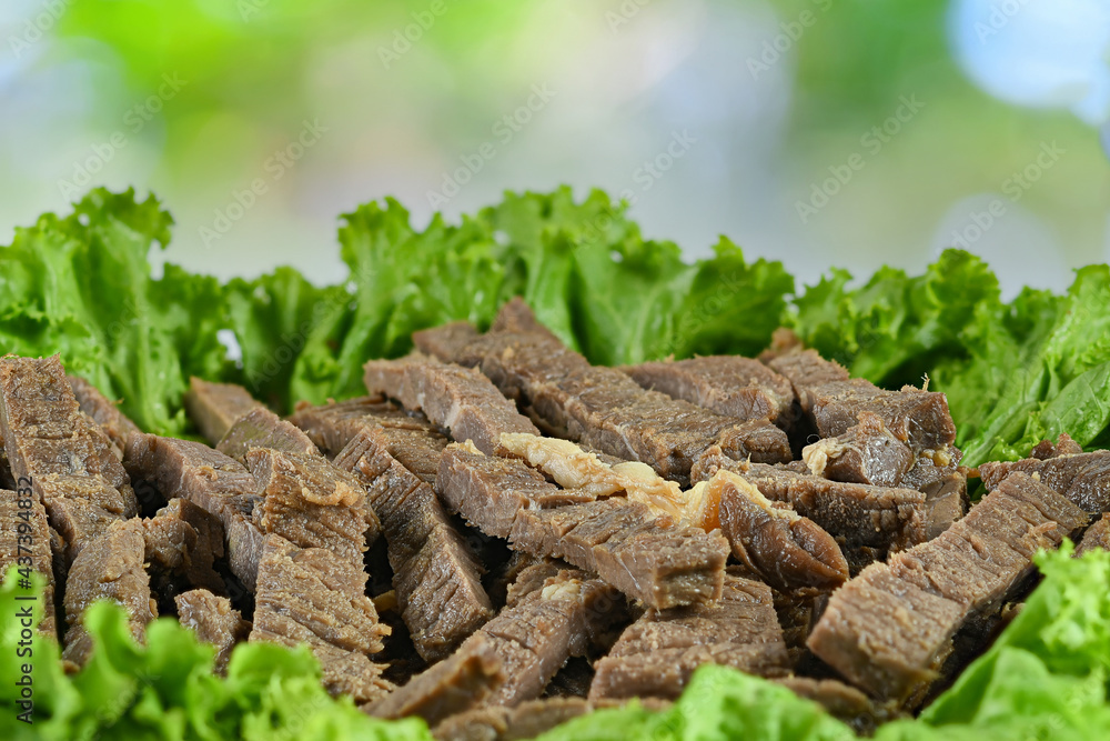 The fried meat cuts into delicious little pieces. The fried meat cuts into delicious little pieces.
