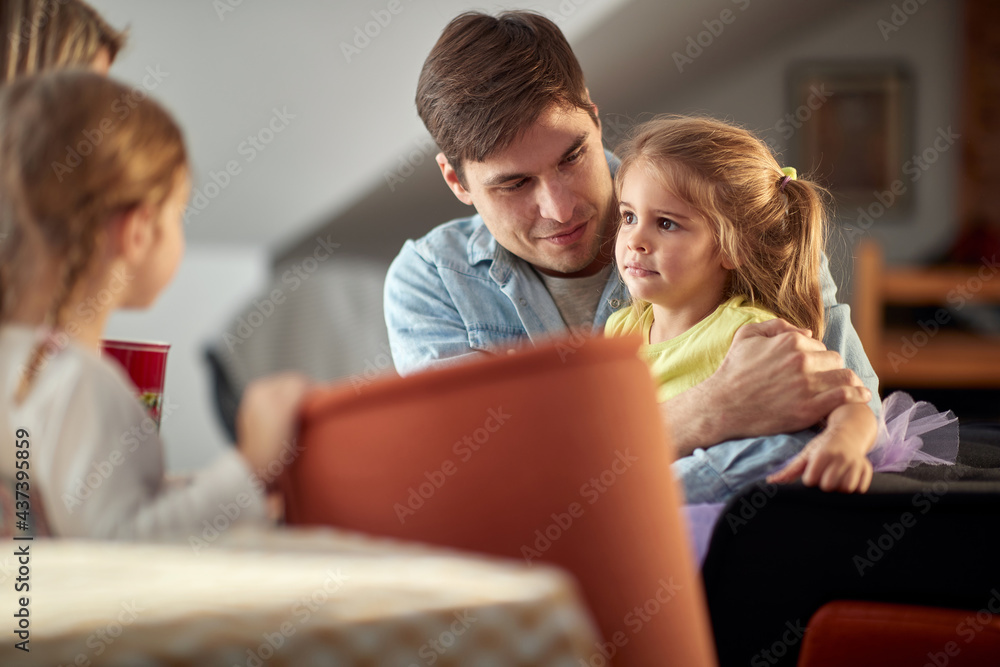 A young family loves to spend time at home together. Family, together, love, home A young family loves to spend time at home together. Family, together, love, home