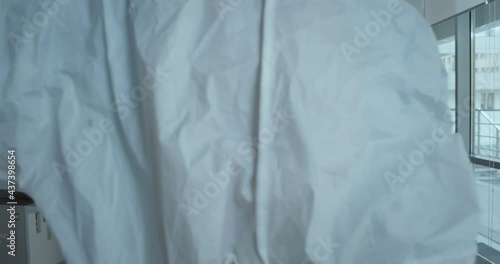 Wallpaper Mural Medical worker in ppe suit cover dead patient with sheet in hospital intensive care unit Torontodigital.ca