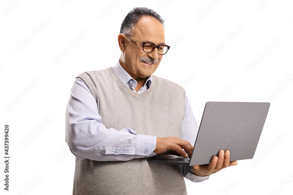 Casual mature man working on a laptop computer Casual mature man working on a laptop computer