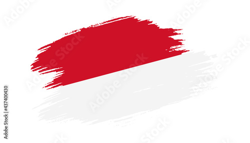Patriotic of Monaco flag in brush stroke effect on white background
