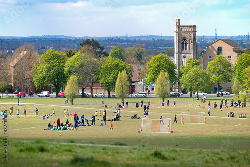 View of Streatham Common in South London, people playing football