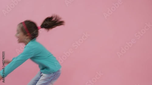 Close-up Portrait Smiling Little Girl Looking at Camera. Funny Playful Laugh of Little Cute Girl. Expressive Cheerful Adorable Kids Face. Concept of a Fun Childhood. Laughing Toddler Shot 4k