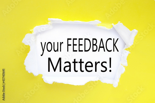 Your Feedback Matters. text on white paper near torn yellow paper
