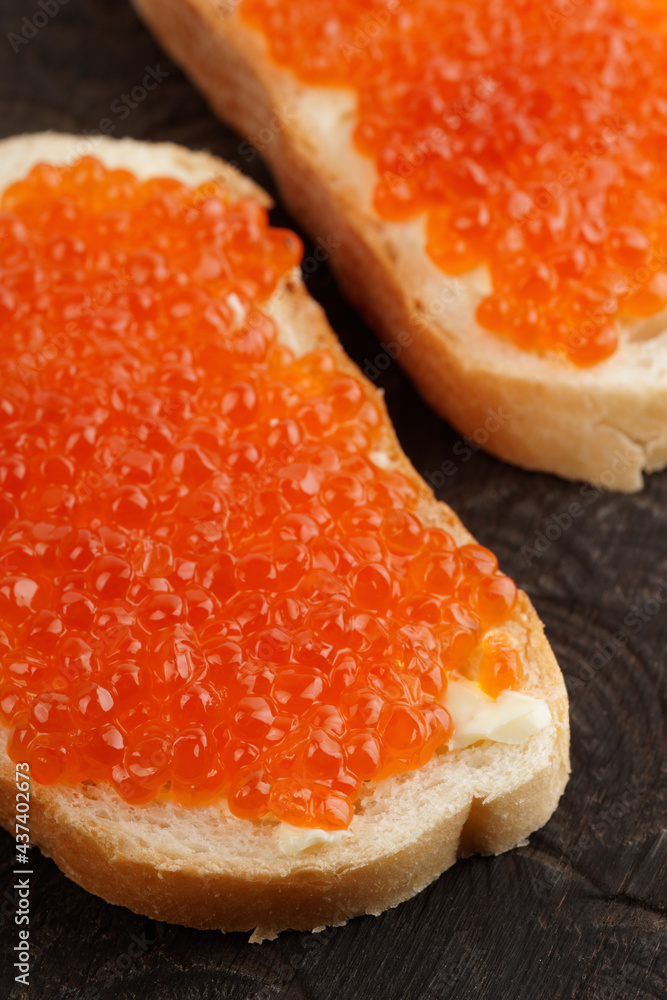 Two loaves of bread with red salmon roe Two loaves of bread with red salmon roe