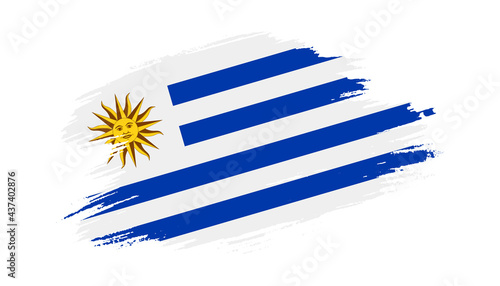 Patriotic of Uruguay flag in brush stroke effect on white background