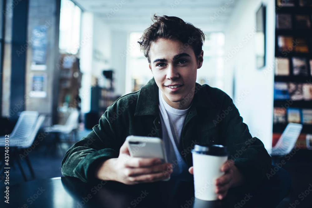 Dreamy man with coffee and phone Dreamy man with coffee and phone