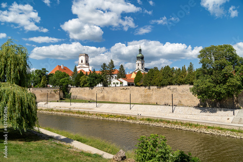 View of Gyor downtown with the Bishops Castle and Cathedral tower by the Raba River.Hungary. photo