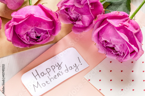 Mother's day gift with peony flowers, envelope and greeting card