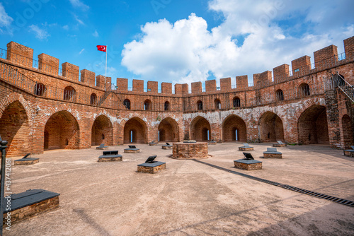 Fototapeta Naklejka Na Ścianę i Meble -  The Kızıl Kule (Red Tower) is a historical tower in the Turkish city of Alanya. The building is considered to be the symbol of the city, and is even used on the city's flag.