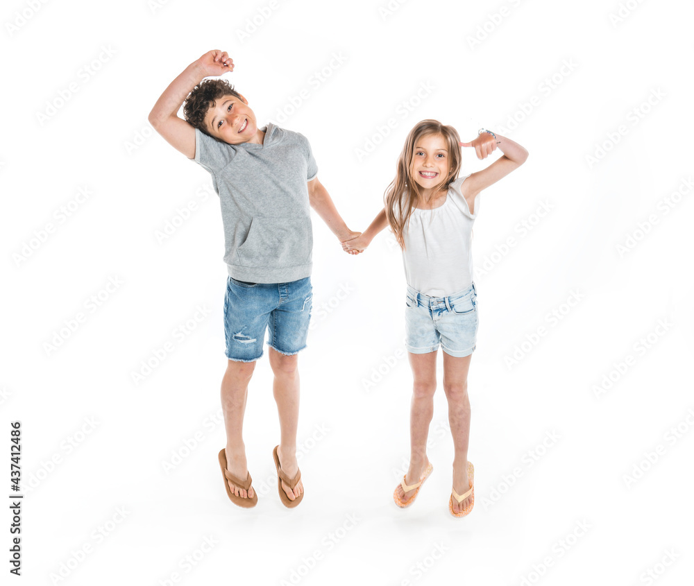Portrait of cute girl and boy on studio white background