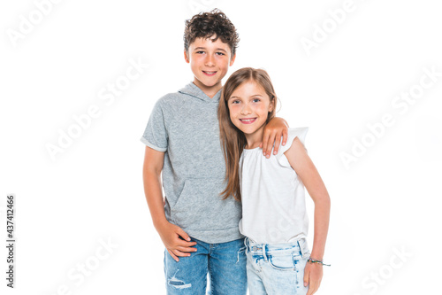 Portrait of cute girl and boy on studio white background