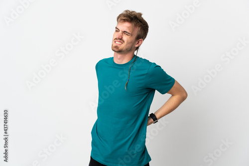 Young handsome man isolated on white background suffering from backache for having made an effort