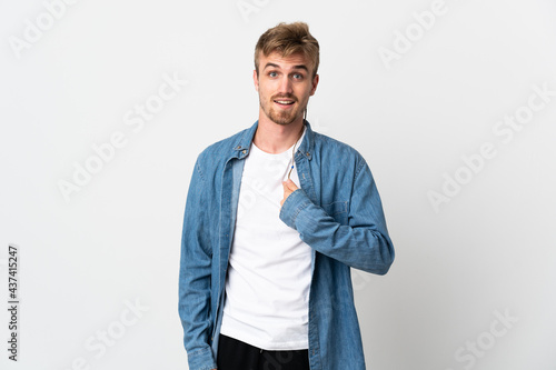 Young handsome man isolated on white background with surprise facial expression