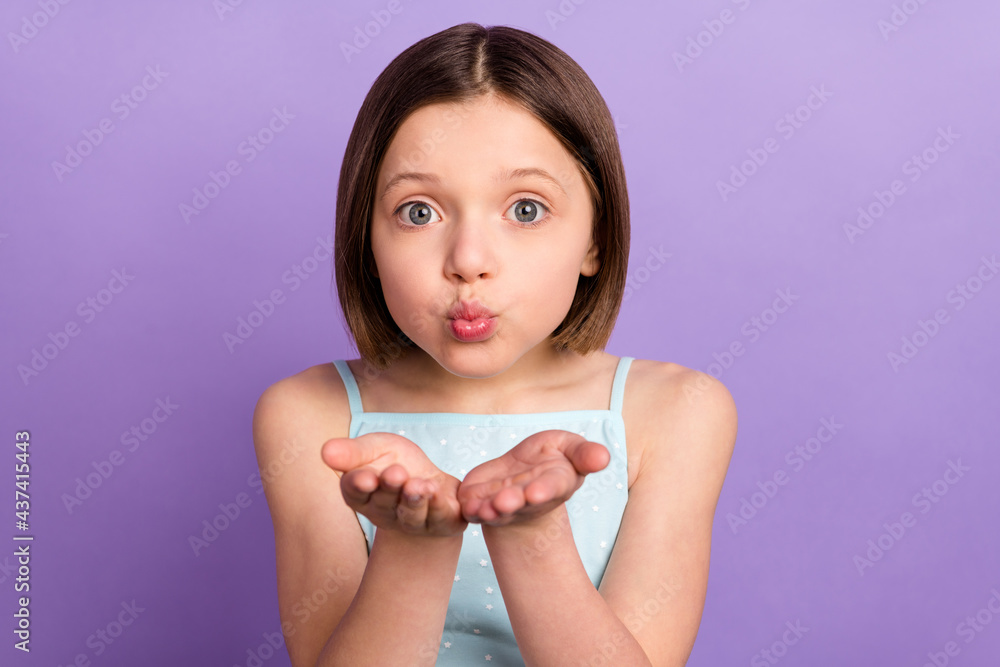 Photo of charming young lovely little girl send air kiss you hands cheerful lady isolated on purple color background Photo of charming young lovely little girl send air kiss you hands cheerful lady isolated on purple color background