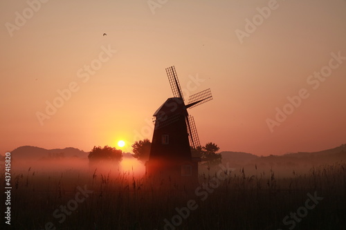 Korean natural scenery, Sorae Wetland Park Sunrise with a foggy windmill