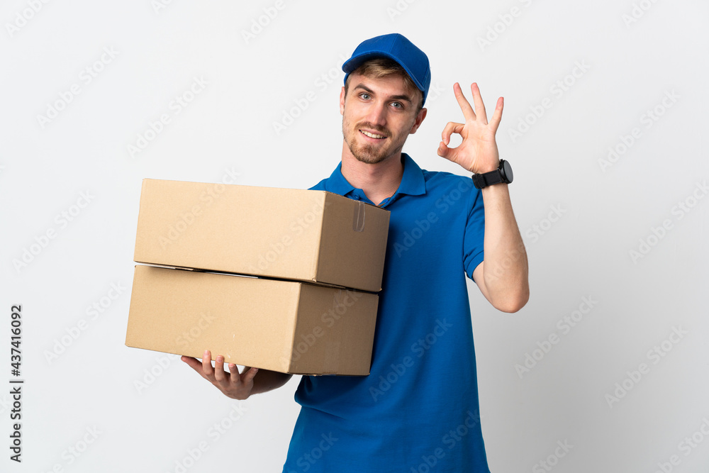 Young delivery blonde man isolated on white background showing ok sign with fingers Young delivery blonde man isolated on white background showing ok sign with fingers