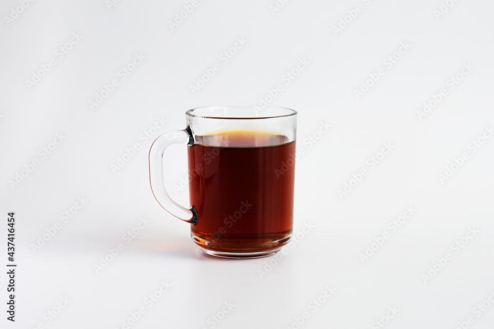 traditional Turkish brewed black tea in a glass cup with a handle. selective focus glass. traditional Turkish brewed black tea in a glass cup with a handle. selective focus glass.