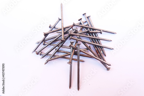 The nails are placed separately on a white backdrop.