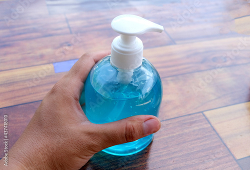 Hand holding hand sanitiser, prevention concept during the COVID-19 situation.