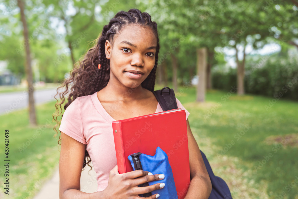 cute black teenager university student on campus with backpack cute black teenager university student on campus with backpack