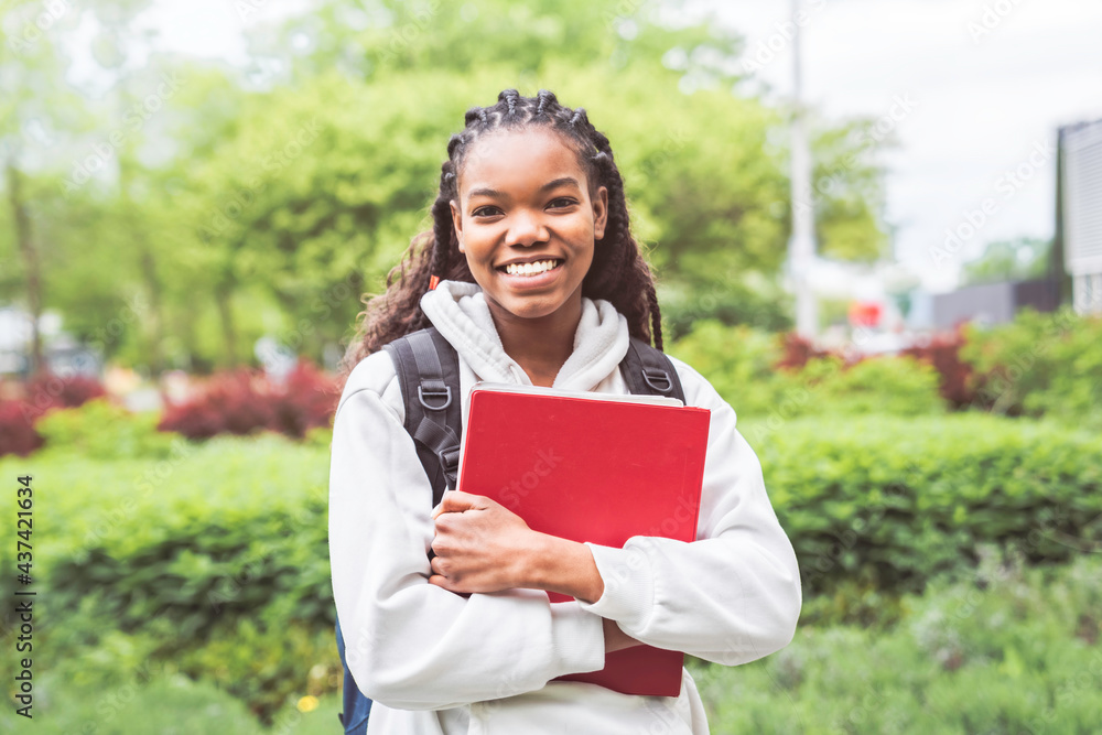 cute black teenager university student on campus with backpack cute black teenager university student on campus with backpack