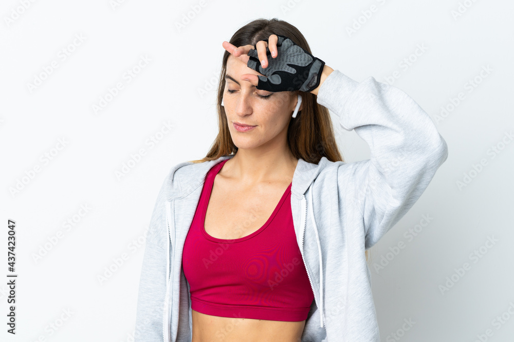 Young sport woman over isolated background with tired expression Young sport woman over isolated background with tired expression