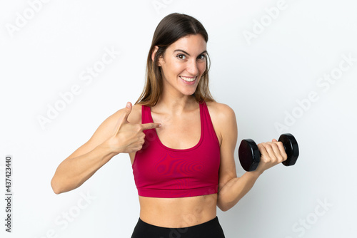 Sport woman making weightlifting isolated on white background with surprise facial expression